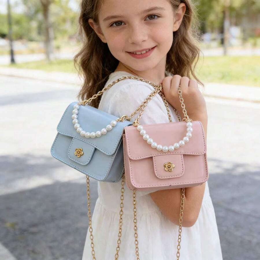 1个女童油性PU山茶花磁扣时尚珍珠手提包，配链条肩带，适合日常四季使用