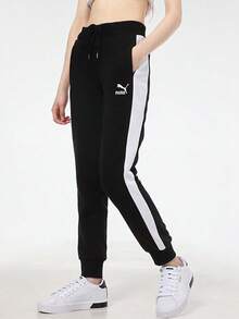 Pantalones deportivos de punto PUMA Iconic T7 para mujer con logotipo bordado, bloques de color y corte jogger de estilo retro. - Negro - Ver 3