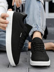 Giày nam cổ thấp đế bằng màu đen trắng tối giản, thoải mái, thoáng khí, chất liệu vải canvas, thích hợp cho hoạt động ngoài trời, đường phố và trượt ván. - Đen và trắng - Xem 5