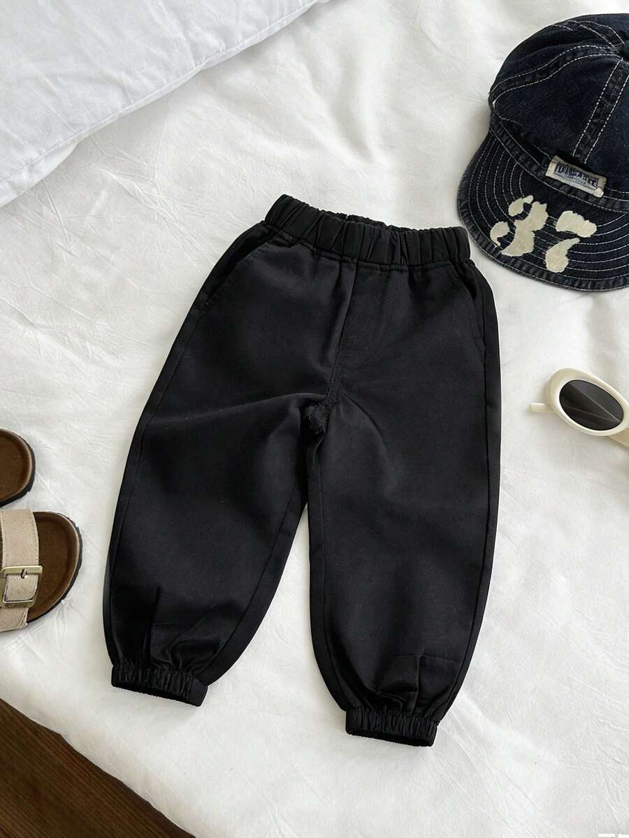 1 chiếc quần jogger đơn giản, màu trơn, thoải mái cho bé trai. - màu đen - Xem 1