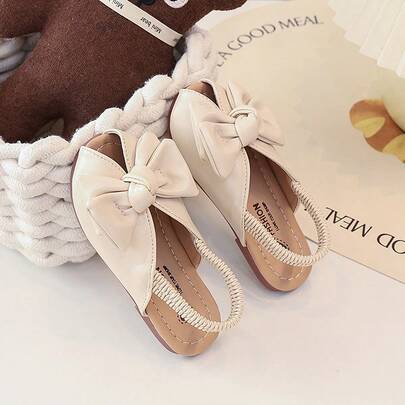 1 đôi dép xăng đan công chúa mùa hè mới cho bé gái, mềm mại, chống trơn trượt, có nơ và quai thun.