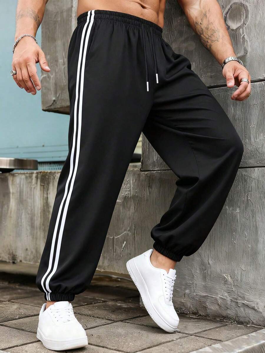 Quần thể thao nam dáng suông kẻ sọc phối màu mới năm 2026, kiểu quần jogger có dây rút, thích hợp cho mùa xuân/hè, thể thao, tập thể dục, giải trí, hoạt động ngoài trời và mặc hàng ngày. - màu đen - Xem 1