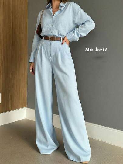 Bộ đồ nữ mùa xuân gồm áo tay dài cổ bẻ cài một hàng khuy và quần ống rộng.