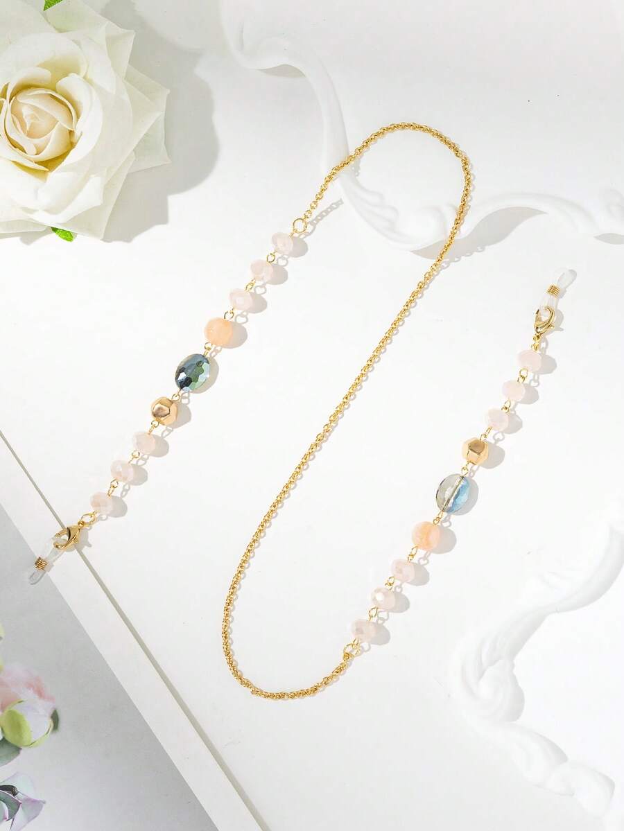 1 chiếc dây đeo kính thời trang đính đá pha lê vàng mới, kiểu dáng tối giản sang trọng, nhẹ nhàng.