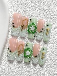 10件套森林主题优雅手工美甲套装，凝胶美甲贴片，包含小花朵、3D玫瑰、十字架、绿色水钻美甲配件、手工捏制五瓣花美甲装饰、绿色指甲油，清新风格，附赠美甲工具（1张果冻贴片+1把指甲锉），三种尺寸可选：杏仁形、鸭形、棺材形美甲，适合聚会、日常、派对、拍照、玩乐、春夏、通勤等场合。 - 彩色 - 查看 4