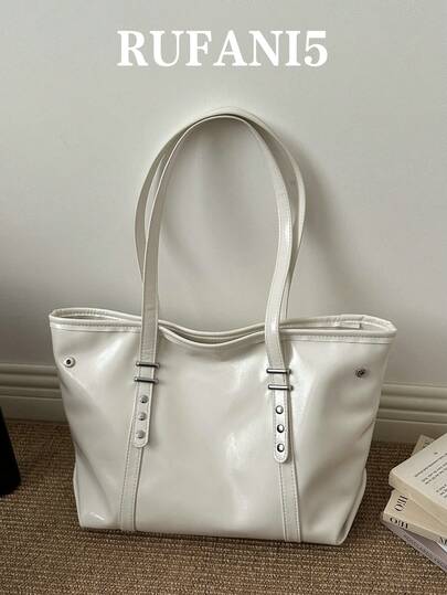 时尚新款纯色大容量通勤实用手提包，经典百搭的复古五金铆钉装饰女士单肩包，适合购物、携带钱包、年轻女性、大学生、职场新人及白领人士。非常适合办公室、大学、工作、商务、通勤、户外活动、旅行和郊游等场合。