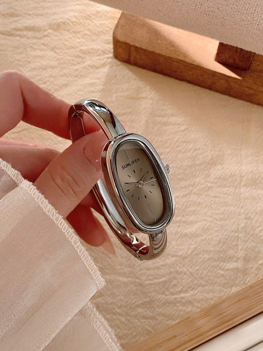 1 chiếc đồng hồ nữ thanh lịch, mặt số xanh lá cây, gọng bạc vàng, kiểu dáng tối giản, thường ngày. - Bạc - Xem 1