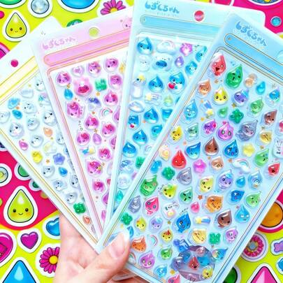 卡通可爱迷你水滴立体水晶浮雕贴纸，可用作手册装饰贴纸。外观精美，采用手册级材质，适合DIY装饰手机、笔记本电脑、行李箱、水杯、滑板、笔记本和吉他等。完美适用于日常使用、儿童生日礼物、返校准备、趣味贴纸、手机壳装饰。奢华。缝纫。DIY。毕业典礼/开学典礼。学校礼物。装饰。儿童。