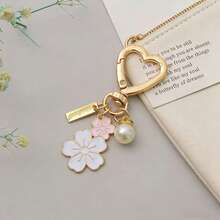 Bộ 12 móc khóa hình trái tim - Bao gồm móc khóa hoa, thẻ cảm ơn và túi quà. Mặt dây chuyền hợp kim hình hoa đôi rất thích hợp cho các dịp như tặng nhân viên, tình nguyện viên, đám cưới, sinh nhật, nghỉ hưu, quà tặng hàng hóa số lượng lớn, phụ kiện nhỏ, quà tặng Ngày của Mẹ, quà tặng phù dâu và phù rể, quà tặng tiệc độc thân, quà sinh nhật, quà tặng phù dâu, quà tốt nghiệp, quà tặng Ngày của Mẹ, quà tặng Ngày Nhà giáo, đồ dùng du lịch, trang trí nhà cửa, v.v. - A - Xem 2