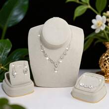 Bộ trang sức thời trang và thanh lịch dành cho nữ, bao gồm dây chuyền, bông tai và vòng tay. - Bạc - Xem 12