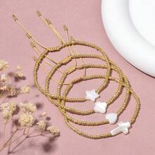 1条波西米亚风串珠手链，包含心形、十字架、星星、四叶草和贝壳图案，可调节长度，适合女性日常和度假佩戴，也是一份很棒的生日礼物。 - 彩色 - 查看 7