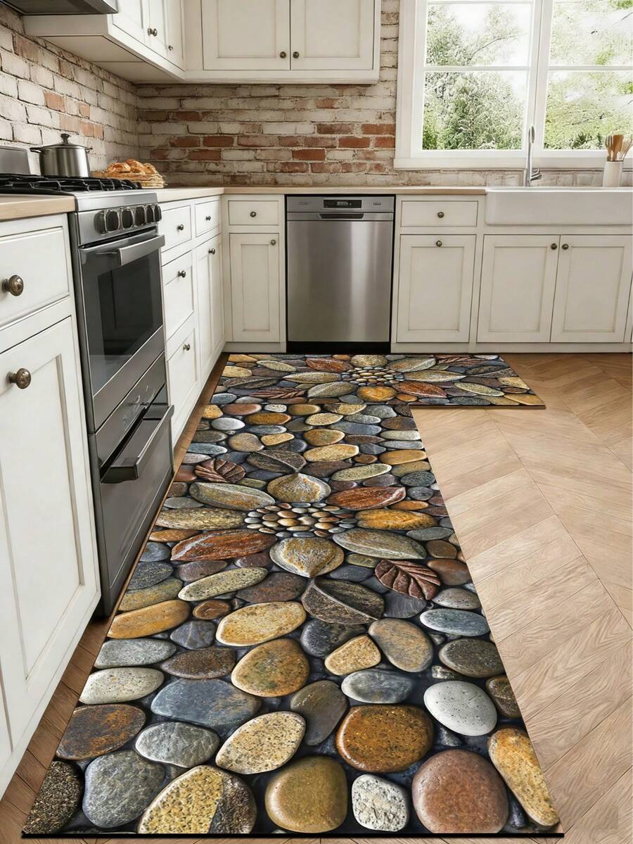1 片硅胶厨房垫，采用超逼真 3D 鹅卵石印花设计，深灰色底面，饰以棕色、黄色、灰色、白色等多种圆形鹅卵石，纹理自然逼真，尽显奢华时尚。这款厨房垫具有缓冲防疲劳功能，表面吸水，中间层为泡沫材质，底部为橡胶材质。 - 彩色 - 查看 1