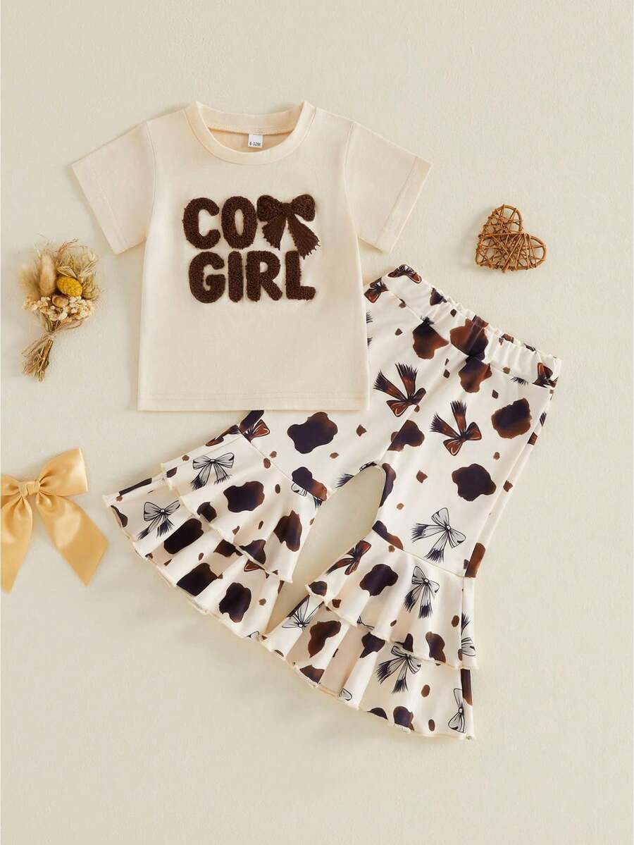 Conjunto de verano de 2 piezas para niña pequeña estilo vaquera: camiseta de manga corta con lazo y letras bordadas y pantalones acampanados con estampado de manchas de vaca. - Albaricoque - Ver 1