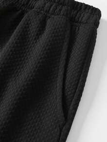 Bộ đồ nam 2 mảnh màu đen dệt kim kiểu waffle gồm áo tank top không tay và quần short, kiểu dáng thoải mái, nhẹ, thoáng khí, cổ tròn, phong cách Hawaii, có thể giặt máy, trang phục đa năng cho kỳ nghỉ hè. - màu đen - Xem 10