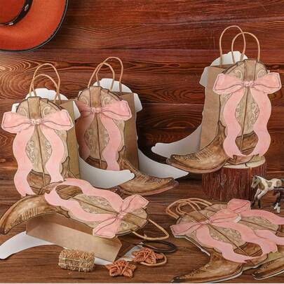 2个西部主题礼品袋 - 牛仔靴造型纸袋，配粉色蝴蝶结手柄，适合装糖果、零食和日常购物，也适合牛仔主题派对、生日和西部风格庆典，以及节日礼品包装。