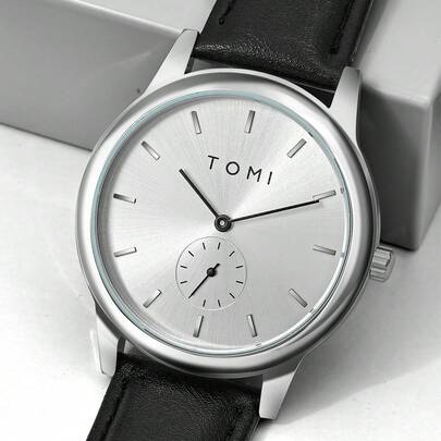  TOMI 简约高端休闲真皮表带腕表，适合青少年和年轻人在通勤和日常生活中使用。