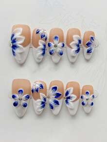 10 piezas de uñas postizas de almendra largas hechas a mano, con una base nude y blanco lechoso con patrones florales 3D azules y detalles de pequeños rhinestones, presentando un elegante estilo chino. Adecuado para que las damas y niñas lo usen en primavera, verano, otoño, invierno, festivales, fiestas y ocasiones diarias - Azul y blanco - Ver 1