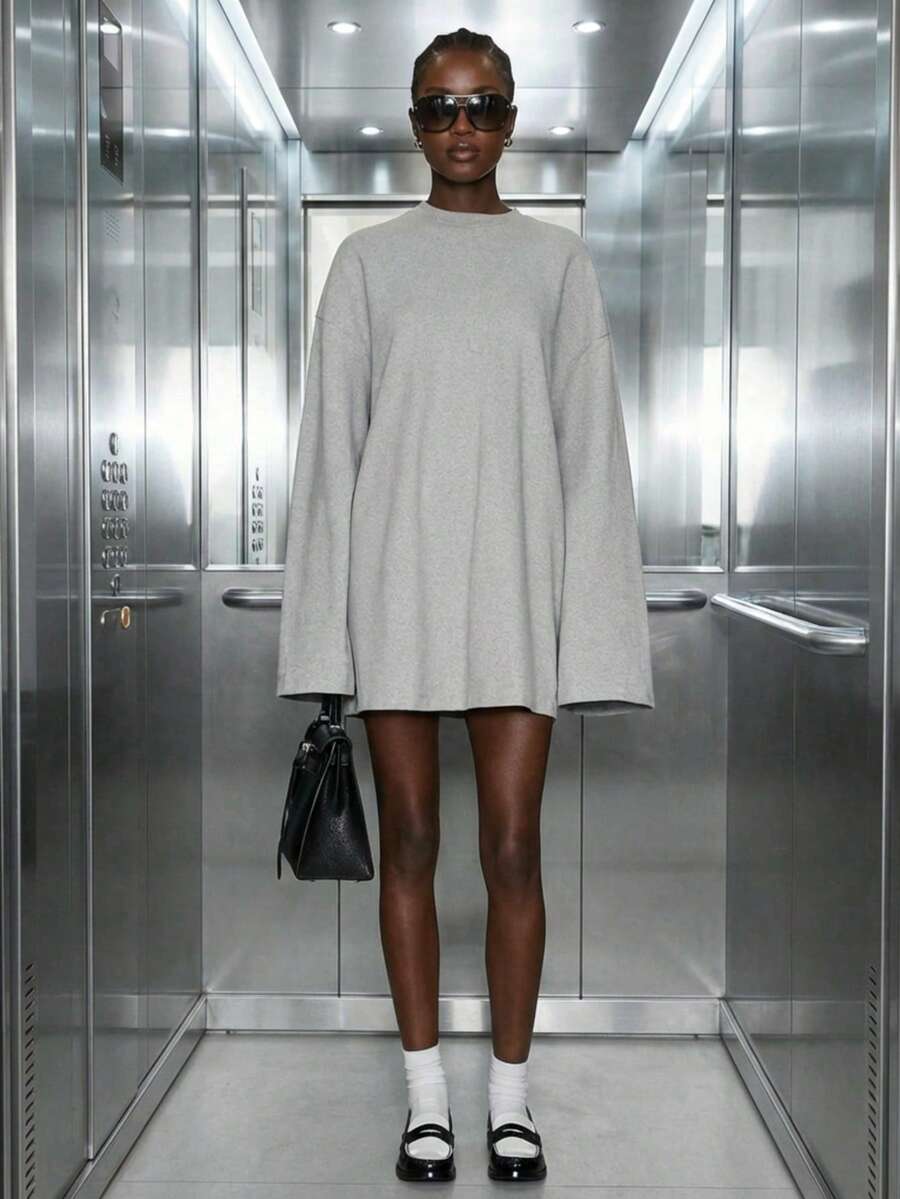 Blusa de moletom feminina longa e folgada, cor sólida, estilo minimalista casual, com ombros caídos, ideal para uso diário, no escritório e na rua.