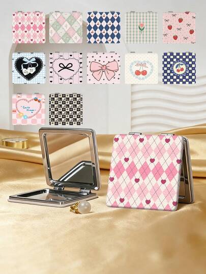 Y2K甜美系列便携式化妆镜，可折叠轻薄便携，采用耐用PU皮革材质，适合各种场合。这款可折叠口袋镜印有卡通时尚的心形、樱桃、蝴蝶结、花朵、钻石图案，结构精巧，经久耐用，防摔可靠。180°旋转，方便手持化妆。