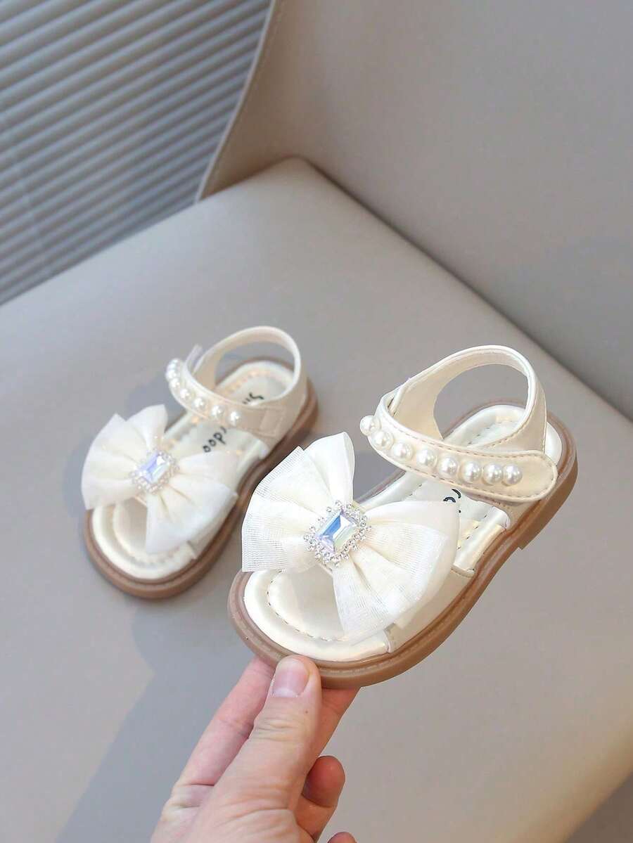 2025 Nuevos zapatos planos de princesa para niñas con suela suave y punta abierta, con , para niños pequeños