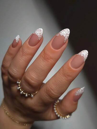 24pcs Nude Pink 3D Lace Nail Art Set, Medium Long Pointed Removable Nail Stickers. Featuring Semi-Transparent Nude Pink Base With White 3D Embossed Floral Pattern, Exuding A Gentle Bridal Style. Suitable For Weddings, Dates And Daily Wear. These High-Quality Reusable Nail Stickers Are Easy To Remove.