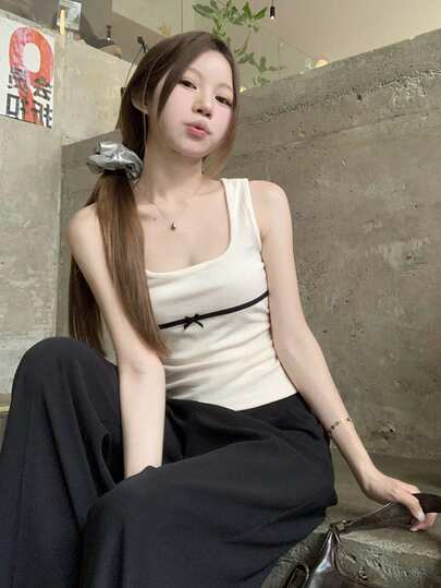Áo hai dây màu trắng gợi cảm dành cho nữ, áo tank top không tay dáng ngắn thiết kế nơ mùa hè.