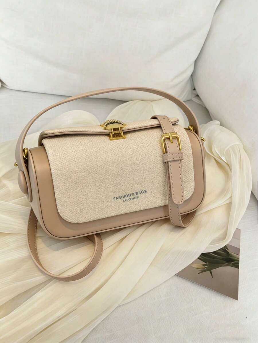 Một chiếc túi xách/túi đeo vai đa năng, thời trang và cổ điển, với thiết kế trang trí ghép mảnh, điểm nhấn chữ cái và phụ kiện kim loại, một chiếc túi xách cao cấp với thiết kế hình hộp nhỏ đa chức năng, tối giản và thanh lịch, phù hợp cho du lịch, mua sắm, đi làm và nhiều dịp ngoài trời khác nhau.