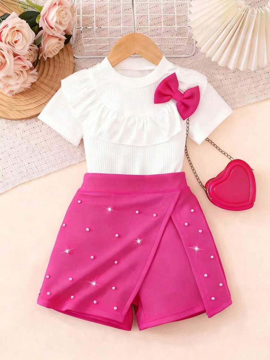 Bộ đồ hè ngọt ngào kiểu Âu & Mỹ cho bé gái, áo tay bồng màu trắng có gân + quần váy đính đá màu hồng cánh sen, thiết kế nơ xinh xắn, trang phục công chúa đa năng cho trẻ em, phù hợp mặc hàng ngày, dự tiệc sinh nhật, mềm mại và thoáng khí, dành cho bé 4-7 tuổi. - Màu Hồng Tươi - Xem 1