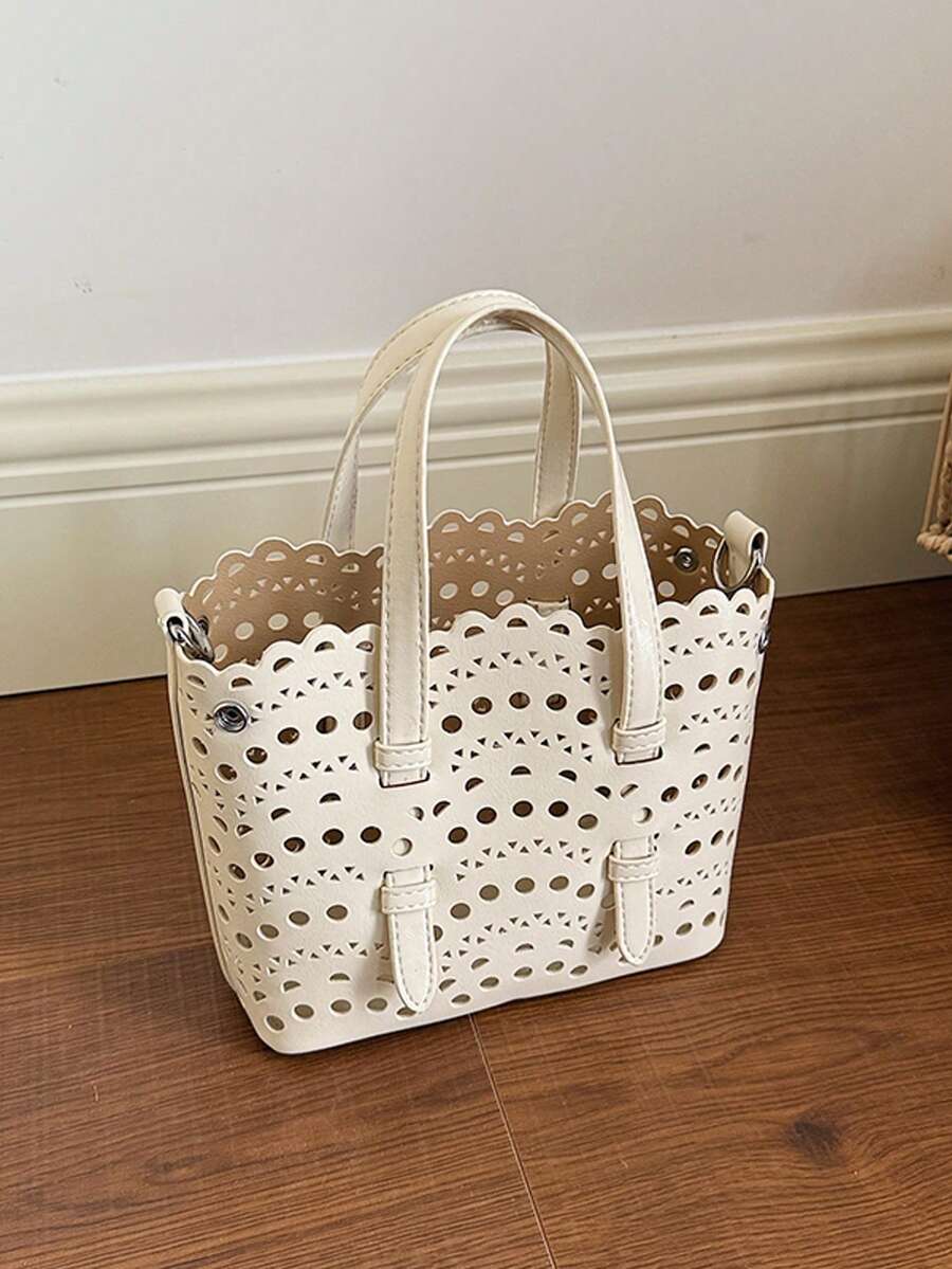 新款春夏高端小众波浪镂空雕花手提包，PU皮女士单肩包，斜挎包/托特包/水桶包