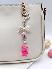 1 pieza Lindo accesorio de bolso con oso, con decoraciones creativas de corazón y estrella, llavero de oso rosa/marrón/rojo rosa adecuado para mujeres y niñas, colgante de oso con lazo exquisito, decoración colgante de oso de resina para mochila, bolso, mochila escolar, habitación, regalo dulce, accesorio de coche, llavero - Multicolor - Ver 9