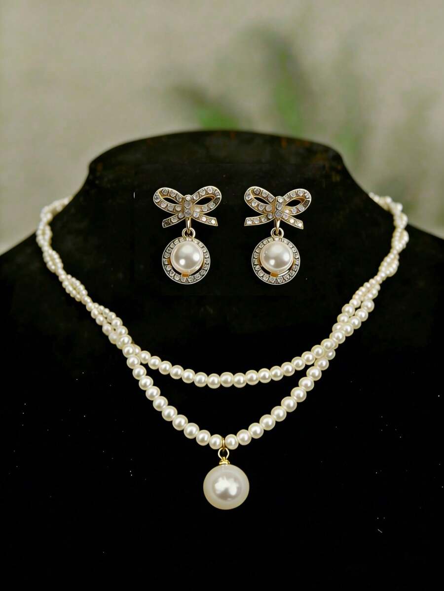 一套简约百搭甜美可爱蝴蝶结仿珍珠耳环项链套装，时尚复古优雅精致缠绕仿珍珠首饰套装，适合女性日常佩戴，也适合节日、派对、宴会、婚礼和约会等场合。 - 彩色 - 查看 1