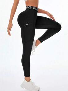 Damen Yoga Hosen mit hoher Taille und Taschen, Leggings mit Buchstaben-Bund, bequemer, dehnbarer Stoff für Fitness, Gym, sportlichen Alltag, Schwarz Frühling - Schwarz - Übersicht 4