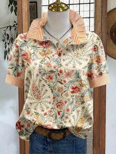 Áo kiểu nữ mùa xuân/hè cổ bèo nhún họa tiết hoa nhí tay phồng phối sọc, thể hiện phong cách đồng quê cổ điển nhẹ nhàng và tươi mới.