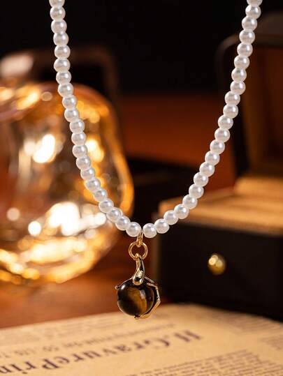 1 chiếc vòng cổ nữ phong cách Bohemian với mặt dây chuyền ngọc trai thủy tinh và đá mắt hổ, phù hợp với trang phục đi nghỉ mát (Lưu ý: Do các lô sản xuất khác nhau, có thể có một số khác biệt về màu sắc; ngoài ra, do ảnh hưởng của ánh sáng và góc chụp, sản phẩm thực tế có thể có sự khác biệt nhỏ về màu sắc so với hình ảnh.)