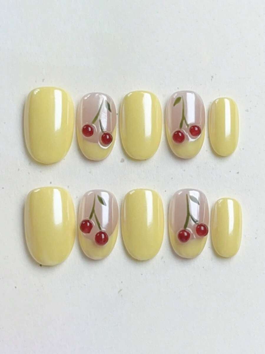 10片纯手工制作的按压式美甲贴片，中号椭圆形美甲，主色调为黄色和裸色。包含手绘黄色法式图案和立体樱桃图案，甜美活泼，温柔优雅可爱，适合女士和女孩在春夏秋冬各种节日、派对和日常生活中使用。 - 黃色 - 查看 1