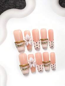 10件套法式波点美甲套装，包含凝胶指甲油、手工白色五瓣花美甲装饰、手工金色3D立体边缘设计、手绘黑色波点美甲贴、米色指甲油、美甲工具（1个果冻贴+1个指甲锉）。提供三种形状：杏仁形、鸭嘴形、棺材形。适用于派对、日常佩戴、活动、摄影、旅行等场合。按压式美甲贴片。 - 彩色 - 查看 11