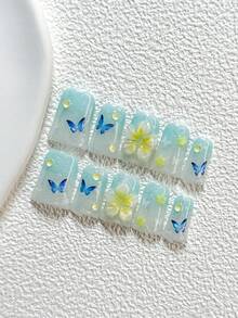 10件套全新清新海洋风手工美甲套装，包含印花美甲贴纸、花朵蝴蝶美甲配件、手工五瓣花美甲装饰、梦幻渐变效果，以及美甲工具（1张果冻贴纸+1把指甲锉），三种尺寸可选：杏仁形、鸭嘴形、棺材形，适合派对、日常、摄影、春夏通勤等场合。 - 彩色 - 查看 19