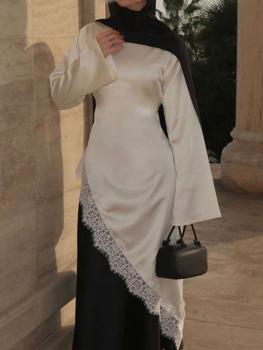 女士优雅蕾丝拼接不对称领口长袖衬衫，纯色梭织面料搭配蕾丝拼接，简约优雅，适合通勤、办公、日常穿着，春夏秋三季白色