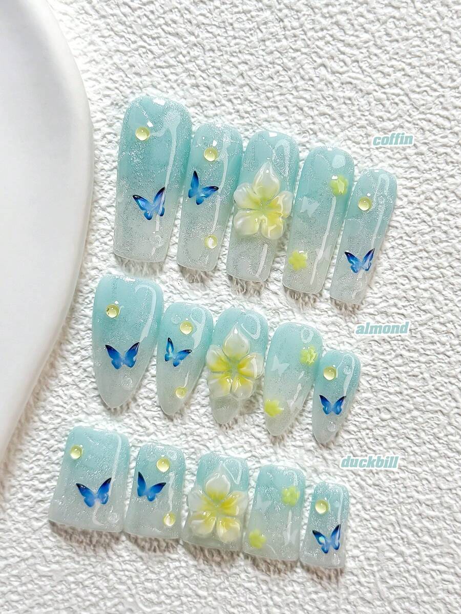 10件套全新清新海洋风手工美甲套装，包含印花美甲贴纸、花朵蝴蝶美甲配件、手工五瓣花美甲装饰、梦幻渐变效果，以及美甲工具（1张果冻贴纸+1把指甲锉），三种尺寸可选：杏仁形、鸭嘴形、棺材形，适合派对、日常、摄影、春夏通勤等场合。 - 彩色 - 查看 1
