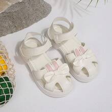 Giày sandal mới năm 2026 cho bé gái, giày mùa hè đế mềm kín mũi cho trẻ em, giày công chúa hình thỏ hoạt hình dễ thương có nơ, giày tập đi mùa hè đa năng đế mềm có khóa dán cho bé gái. - trắng - Xem 23