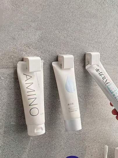 حامل معجون الأسنان المثبت على الحائط، لا يحتاج إلى ثقب، يمكن استخدامه لتخزين منظف الوجه ومعجون الأسنان، تخزين الحمام/المرحاض، مع خطاف، معلق، رف تخزين حائطي متعدد الوظائف للحمام