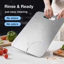 Esta tabla de cortar de acero inoxidable de alta calidad es resistente a la oxidación y duradera, con doble uso para cortar carne, frutas y verduras. Es lavable y de larga duración, disponible en múltiples tamaños. - Ver 12