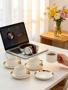 Conjunto de 6 xícaras e pires TAO, estilo minimalista francês, com borda dourada e listras verticais brancas. Inclui xícara de café e pires para chá. Pode ser lavado na lava-louças. Ideal para hotéis, restaurantes, cozinhas domésticas, decoração de mesa, chá da tarde, café, chá de ervas, presentes personalizados, lembrancinhas, utensílios de cozinha, festas, aniversários, casamentos e jantares. Perfeito como presente para o Dia dos Namorados, Dia das Mães e Dia dos Pais. - Multicolorido - Ver 4