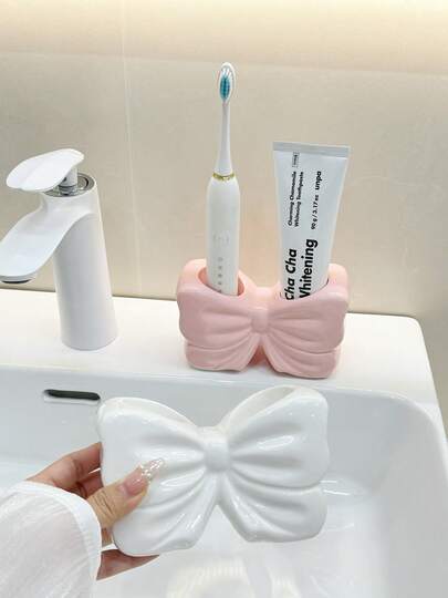 Zahnbürstenhalter in Schleifenform, süßer Zahnbürstenhalter und Kosmetikaufbewahrungsregal, personalisierte Dekoration mit Schleife, Zahnbürstenaufbewahrungsregal in Schleifenform, Badezimmer-Abstellflächen-Accessoire, Haushaltsbadezimmer-Artikel (Rosa/Weiß), auch als dekorative Vase auf dem Schreibtisch verwendbar