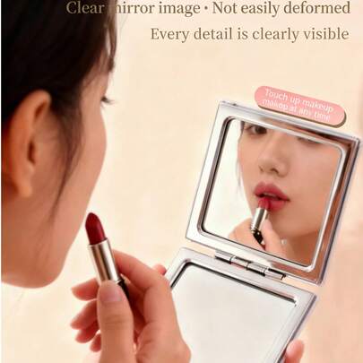 1 Chiếc gương trang điểm gấp gọn di động tinh tế, gương tròn hai mặt cầm tay, kích thước nhỏ gọn bỏ túi dành cho nam nữ khi đi du lịch và hoạt động ngoài trời.