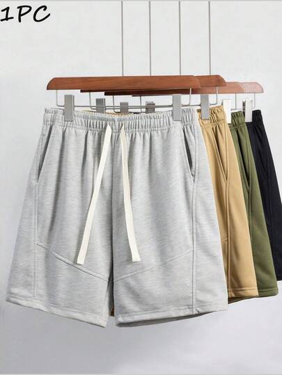 男士宽松休闲运动短裤，适合健身、篮球、训练、跑步、锻炼、街头、露营、海滩等场合，弹性腰带设计，配有抽绳调节，夏季穿着。