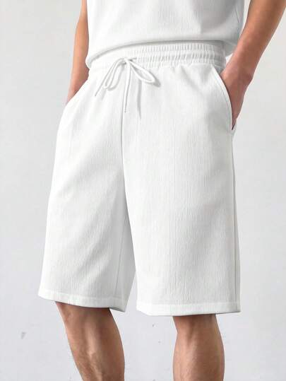 Pantalones cortos casuales para hombres de unicolor con cintura con cordón y bolsillos en diagonal