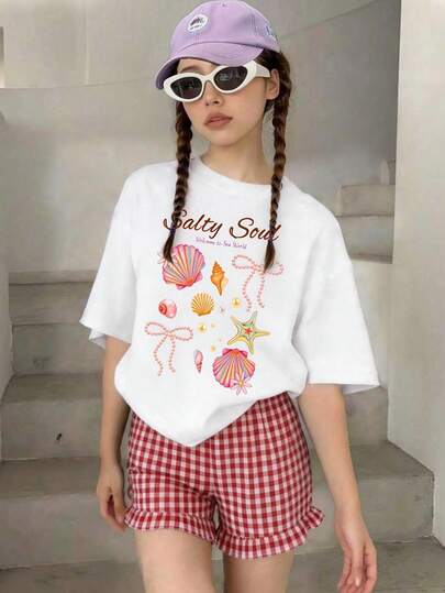 Designed Specifically For Tween Girl, This Casual Features A White Crew-Neck T-Shirt Paired With Red Plaid Shorts, Adorned With A "Shell Bow" Graphic Print-Making It The Perfect Choice. It Is Suitable For A Wide Variety Of Occasions, Looking Perfectly Appropriate Whether For School, Shopping, Everyday Wear