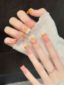 10 piezas de uñas postizas cortas con forma de pato, degradado naranja-rosa, decoradas con flores 3D y strass, hechas a mano - Naranja Quemada - Ver 2