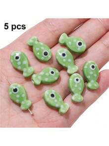 5/12 hạt gốm hình cá, dùng để làm trang sức - Thiết kế chấm bi nhiều màu, mắt đen bóng, chất liệu không khảm, nguyên liệu tự làm trang sức, thích hợp cho vòng tay, vòng cổ, móc khóa. - Nhiều màu - Xem 16